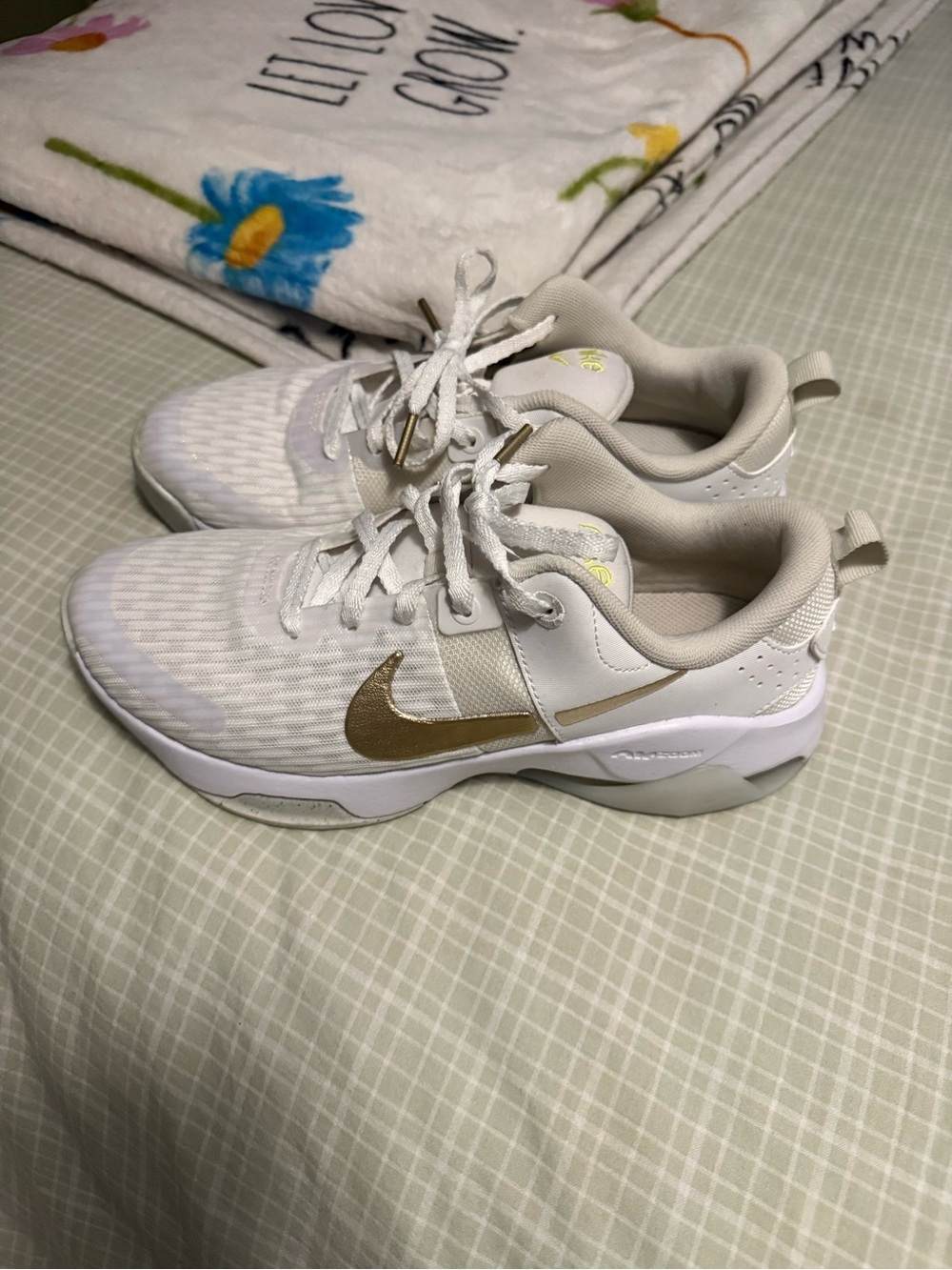 Nike White Athletic Sneakers with Gold Swoosh